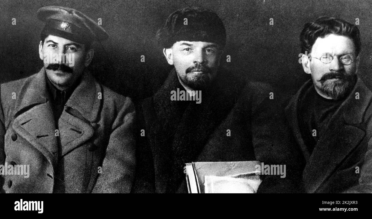 Photograph of three prominent Russian revolutionaries. Left to right: Joseph Stalin (1878-1953) leader of the Soviet Union, Vladimir Lenin (1870-1924) and Mikhail Kalinin (1875-1946) head of state of the Russian SFSR and later of the Soviet Union. Dated 20th Century Stock Photo