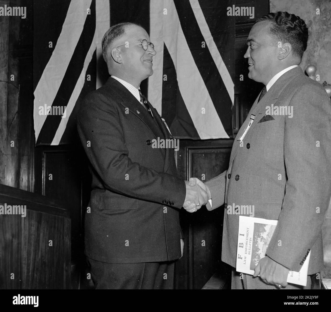 J. Edgar Hoover, (right) Director of The Federal Bureau of Investigation, is greeted by Arthur Muchow, President of the International Association for Identification, as he arrived at the Willard Hotel today to welcome Delegates to the Annual Convention of the Association. 1937 . J. Edgar. Hoover 1895-1972. Director of the FBI (Federal Bureau of Investigation), from 1924-1972. Stock Photo