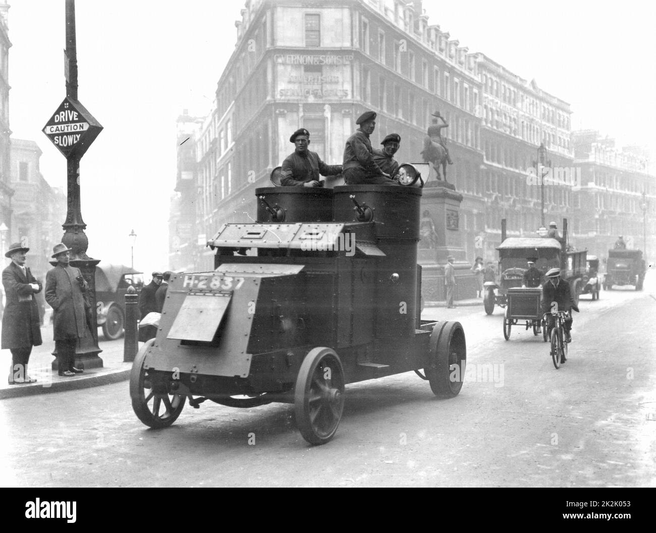 General Strike, Britain, 1926. Food convoy being escorted along Holborn,  London, by troops in armoured cars. Photograph. Stock Photo