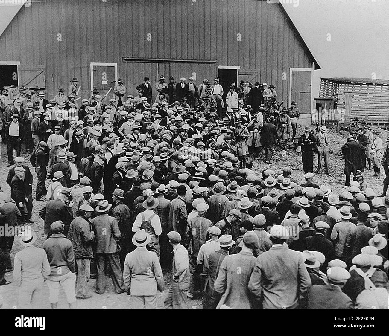 Depression in the United States, early 1930s. A foreclosure sale in Iowa brought about by inflation. Military police are in attendance to control farmers intent on stopping the auction. Stock Photo