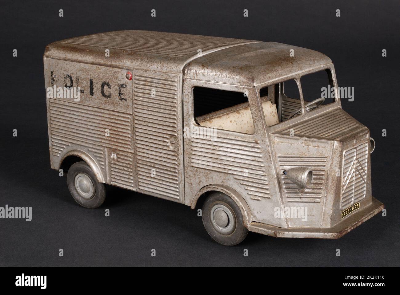Toy French police van, Citroen (HY,)  brand JRD Spring mechanism with a key, carbody in corrugated iron, lacquered in grey 1955 Private collection Stock Photo