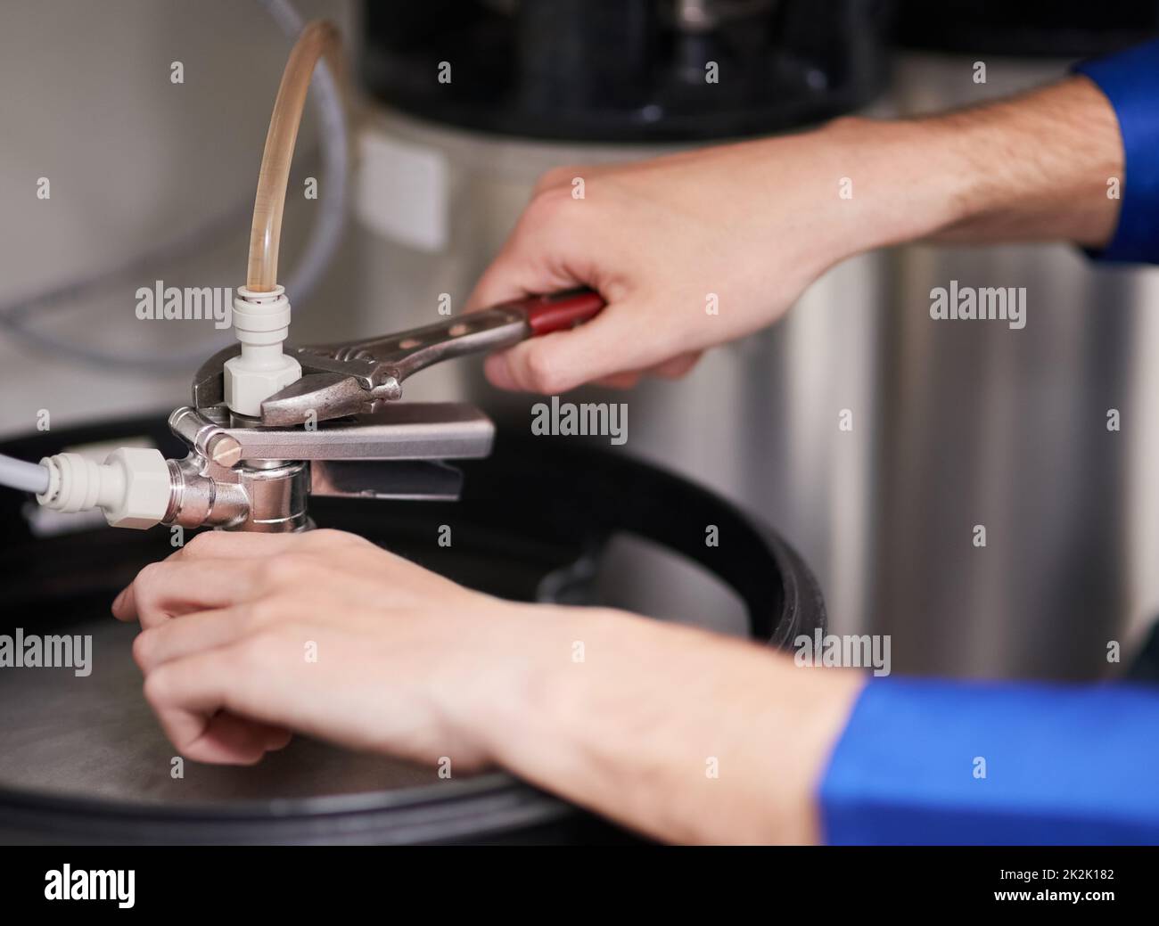 https://c8.alamy.com/comp/2K2K182/skilled-hands-working-on-your-water-heating-system-cropped-shot-of-a-handyman-repairing-a-pipe-on-a-water-heater-2K2K182.jpg