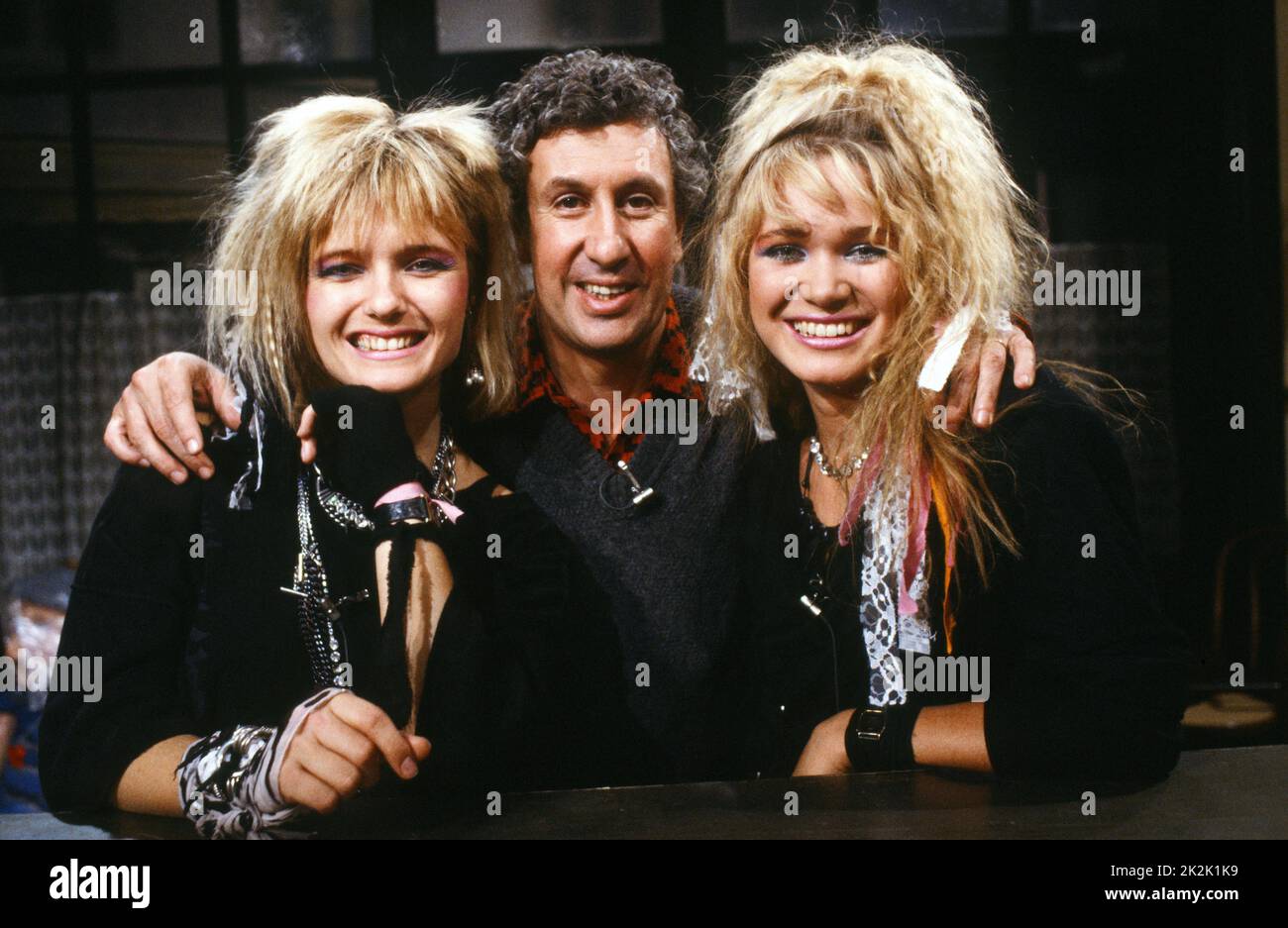 Stéphane Collaro and the Norwegian pop group Dollie de Luxe (Ingrid Bjornov and Benedicte Adrian) on the set of the TV show 'Cocoricocoboy' in 1985. Stock Photo
