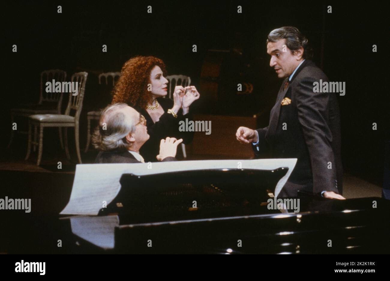 Julia Migenes and Lalo Schifrin in a duet on the set of the television programme 'Le grand échiquier', accompanied by the French composer Michel Legrand, 1989. Stock Photo