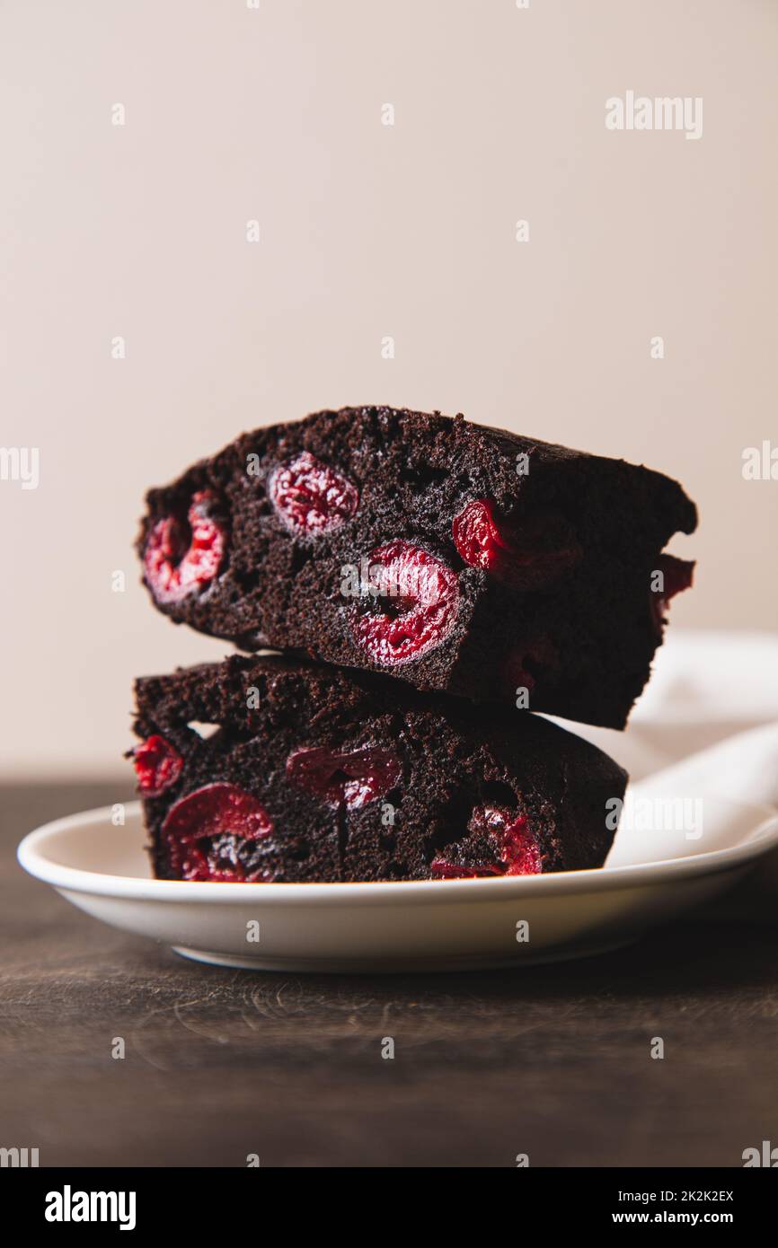 brownie with cherry. A stack of chocolate brownies, homemade bakery and dessert. Bakery, confectionery concept Stock Photo