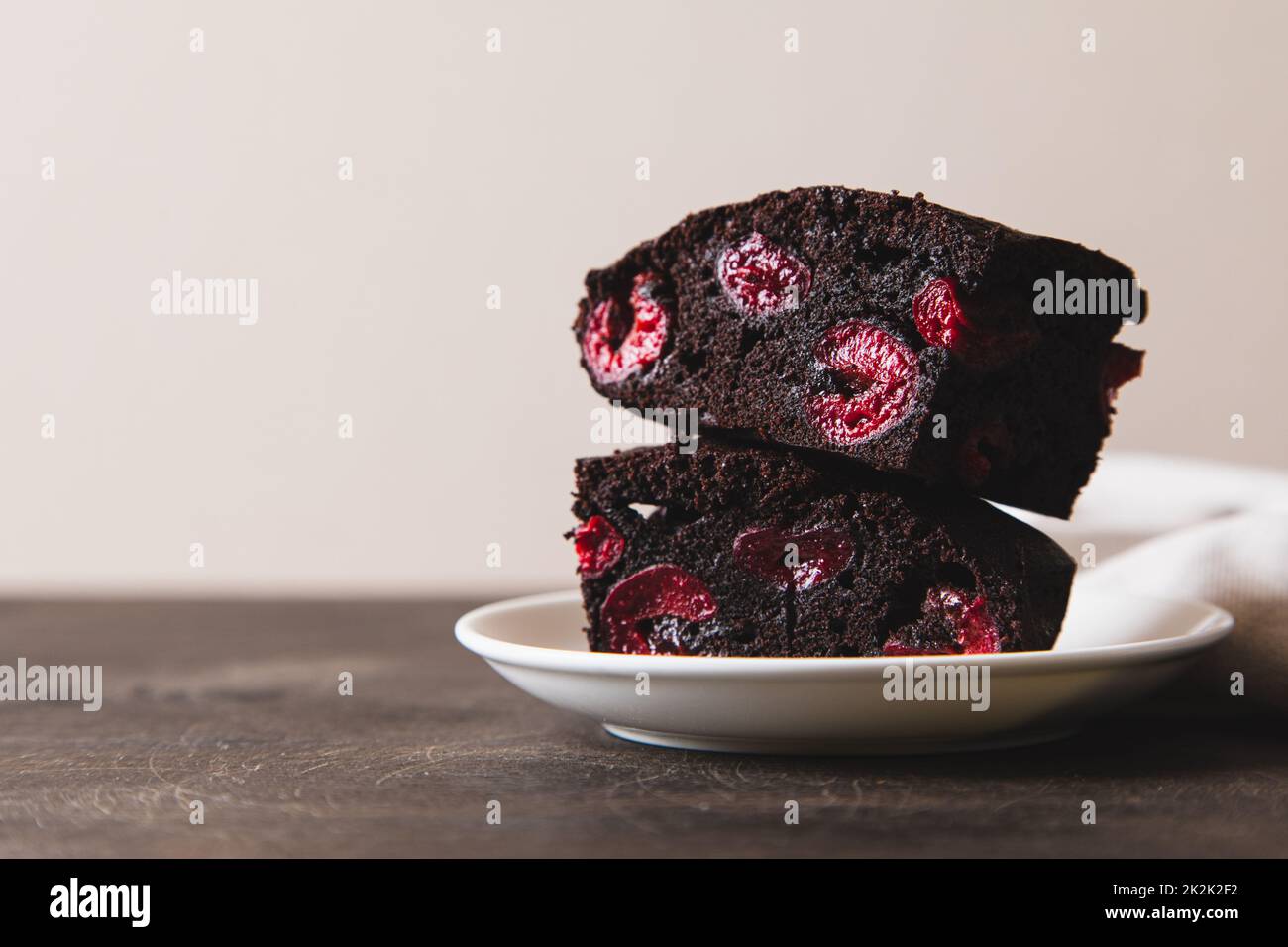 brownie with cherry. A stack of chocolate brownies, homemade bakery and dessert. Bakery, confectionery concept Stock Photo