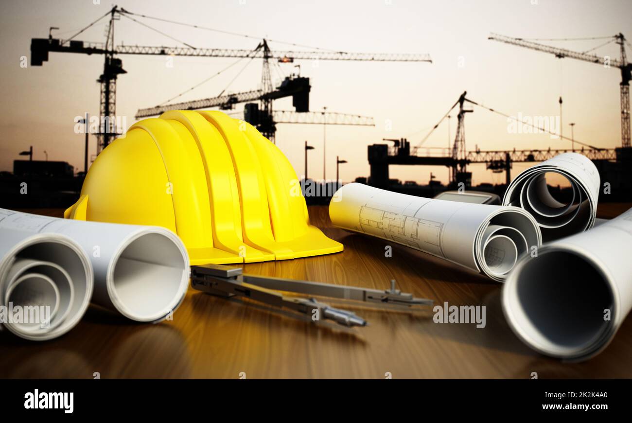 Construction blueprints, hardhat and tools on the table Stock Photo