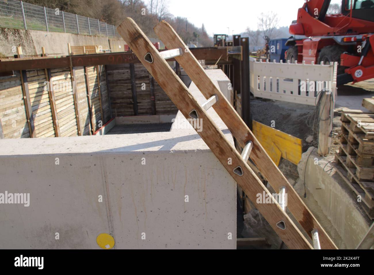 ladder is at risk of falling over a pit Stock Photo Alamy