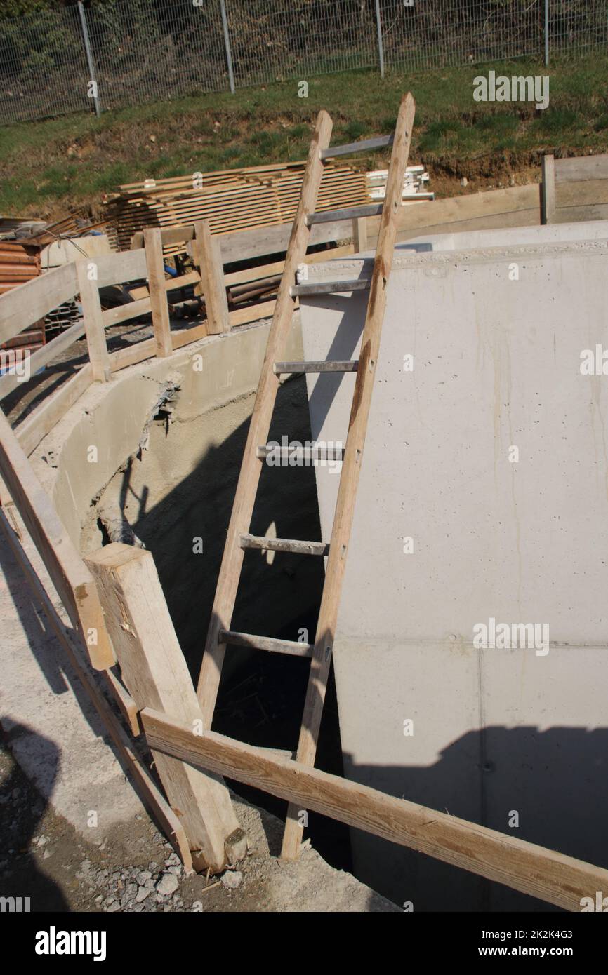 ladder is at risk of falling over a pit Stock Photo Alamy
