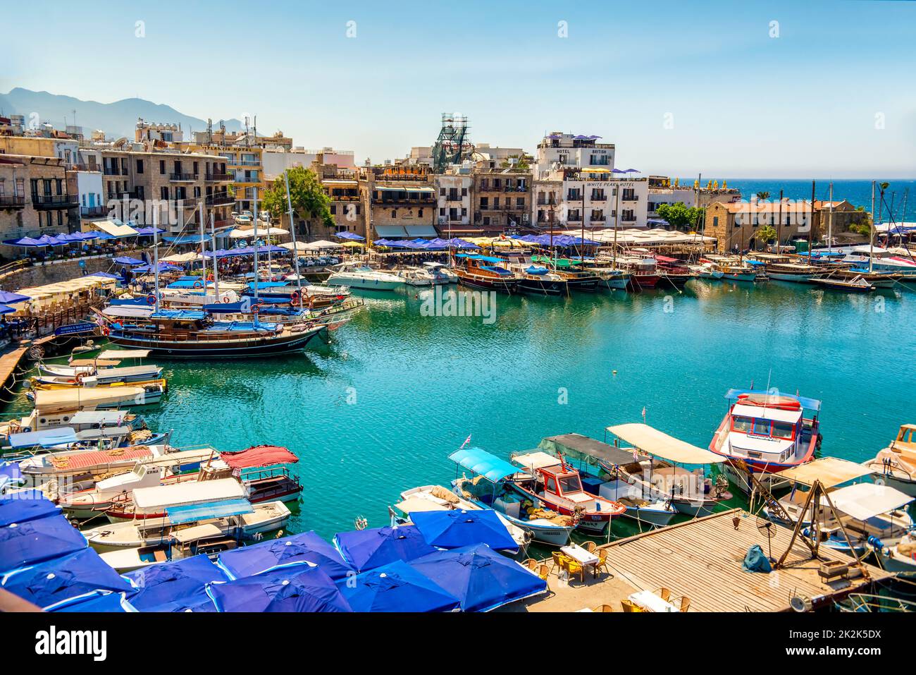 Kyrenia (Girne), CYPRUS - JULY 5: Historic harbour and the old town on July 5, 2015. Kyrenia harbor is currently a famous tourist resort. Stock Photo