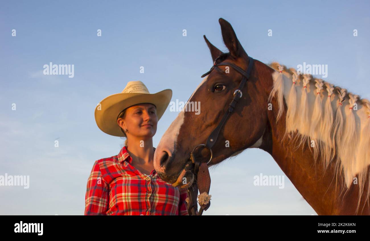 Western girl with her horse Stock Photo
