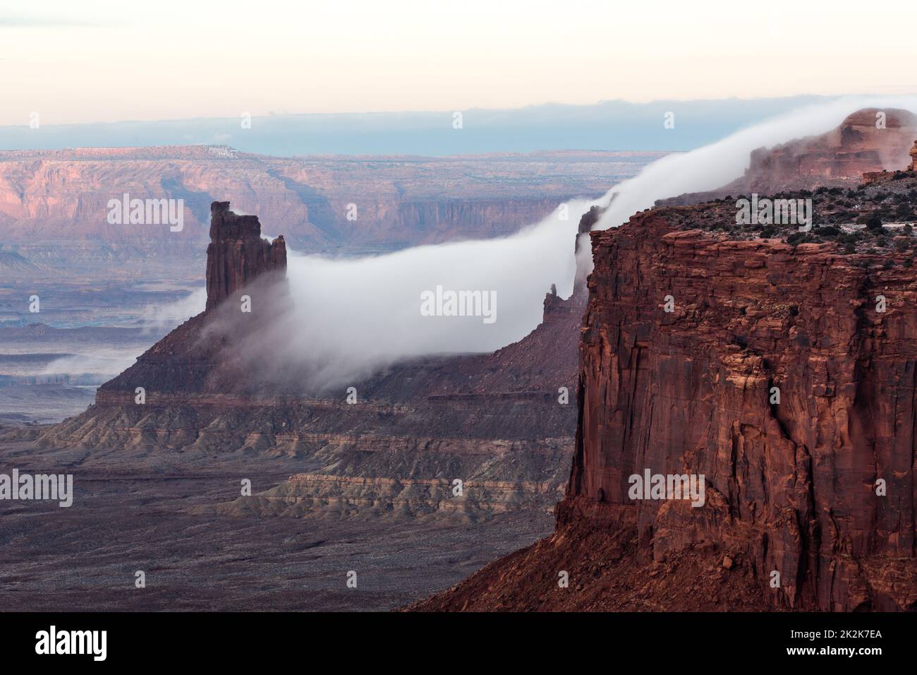 Low clouds flow off the mesa around the Candlestick Tower during a ...