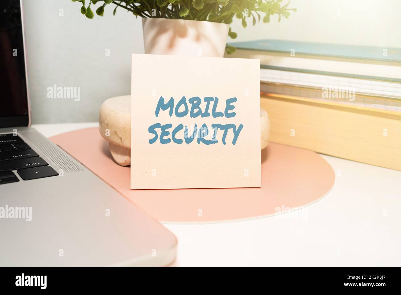 Writing displaying text Mobile Security. Business overview Protection of mobile phone from threats and vulnerabilities Office Supplies Over Desk With Keyboard And Glasses And Coffee Cup For Working Stock Photo