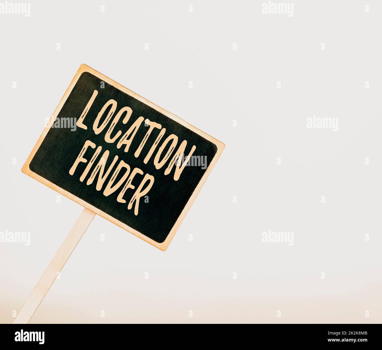Text sign showing Location Finder. Word for A service featured to find the address of a selected place Blank Sign Note Holder For New Announcments. Placard For Recent Ideas Plans Stock Photo