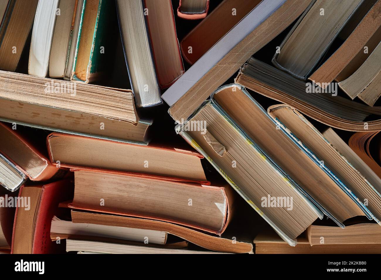 Wall of books piled up Stock Photo Alamy