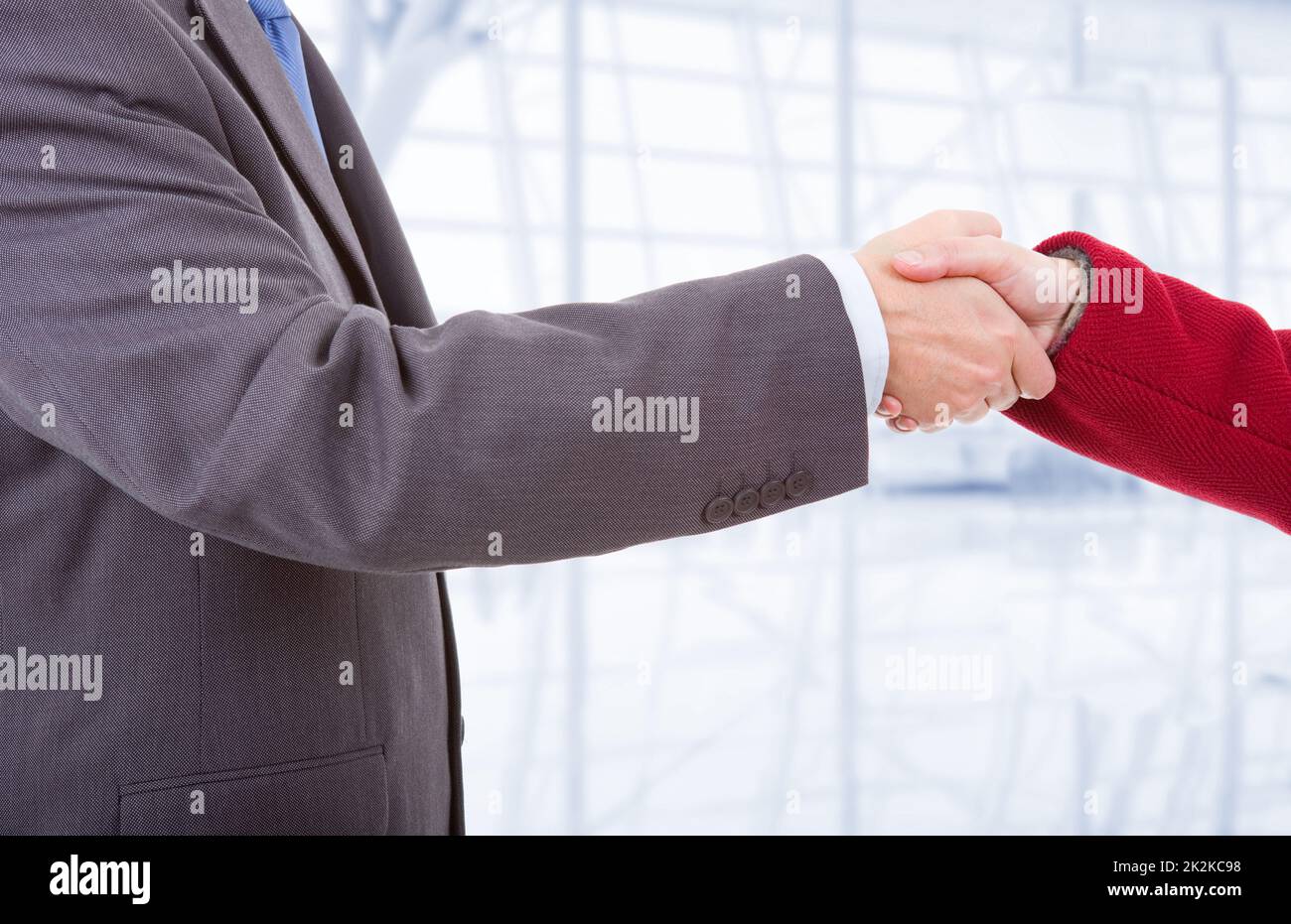 business couple shaking hands Stock Photo