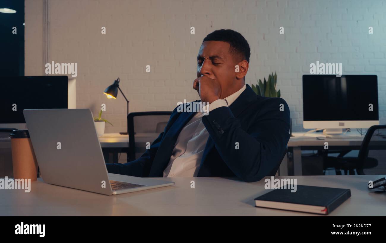 Tired african american businessman yawning hi-res stock photography and ...