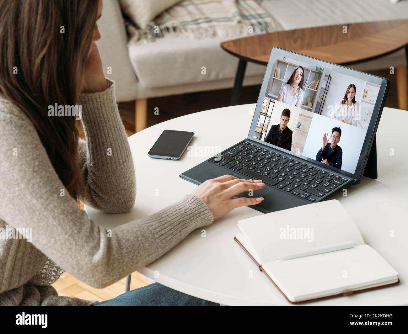 Digital study. Group virtual chat. Online learning. Diverse students working online watching teacher video lesson on laptop screen at home office work Stock Photo