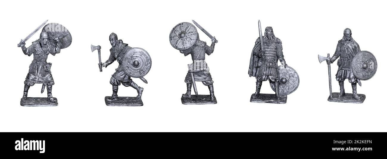 Vikings. Medieval knights in different poses. Photo with tin figures. Stock Photo