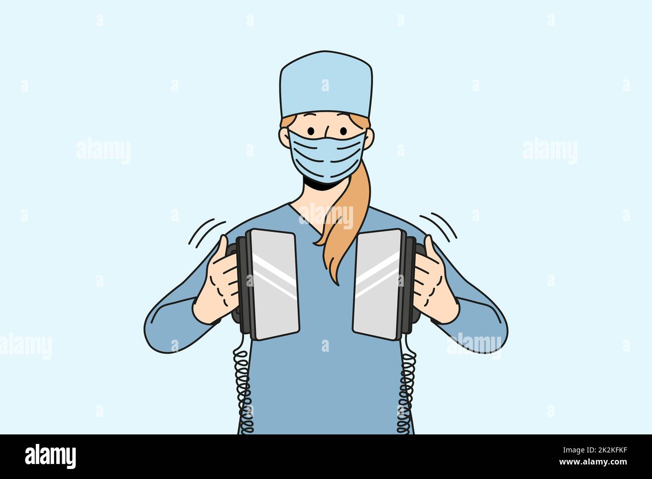 Nurse hold defibrillator resuscitating in hospital Stock Photo