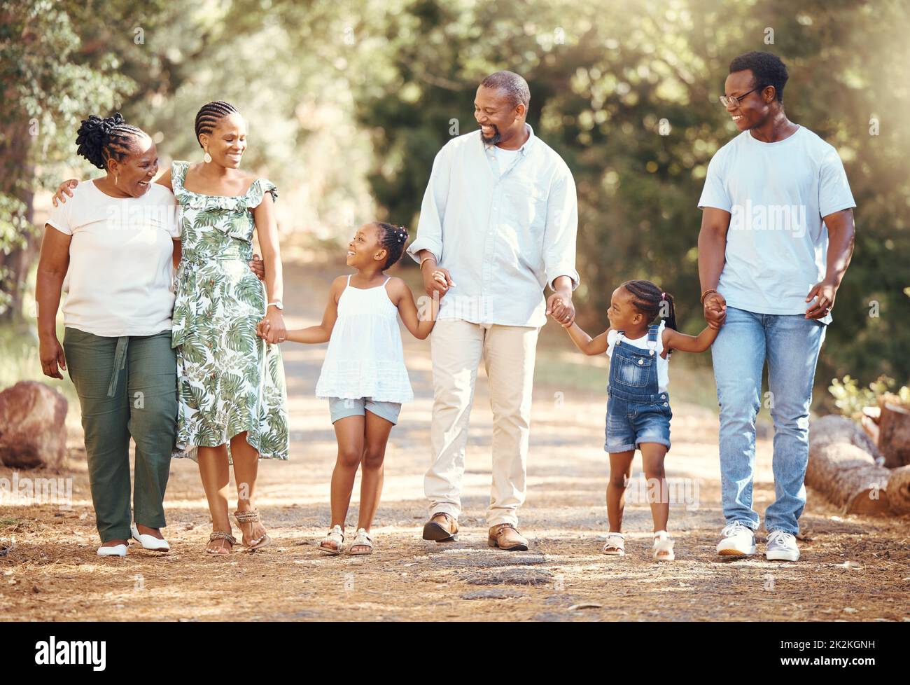 Black big family, love and a walk in nature, outdoors or outside on holiday, vacation or trip. African ancestry, grandmother or children with mother Stock Photo