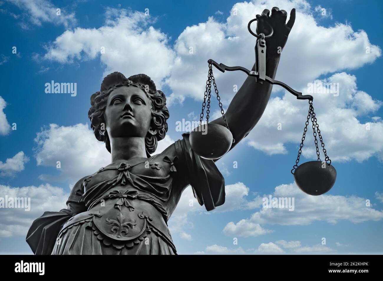 Symbol of Justizia figure in Frankfurt over cloudy summer sky Stock Photo