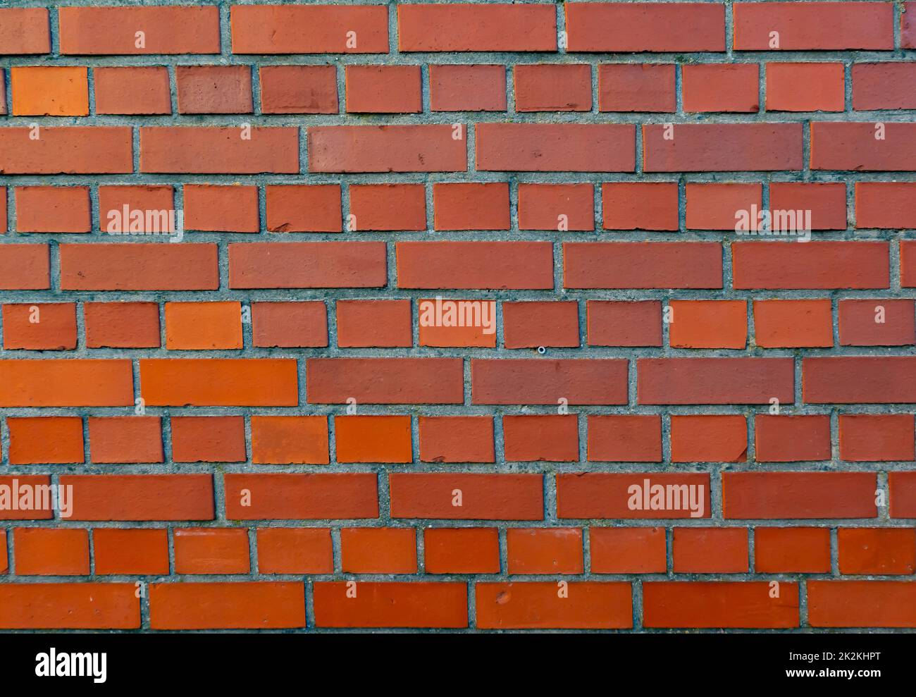 Red Brick Wall full frame in detail Stock Photo