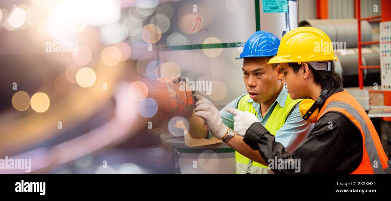 Two workers man talking working in factory Stock Photo