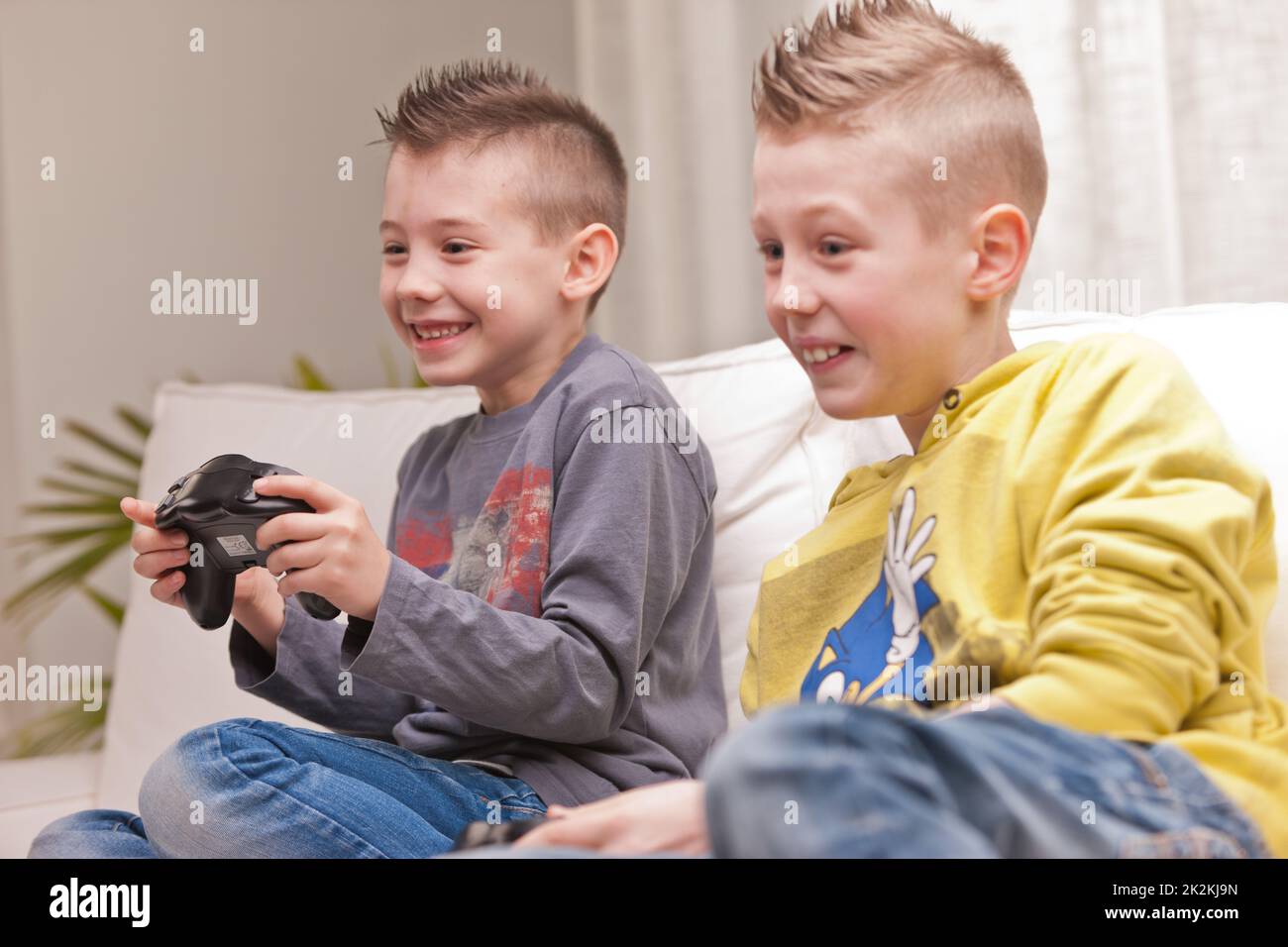 Kids playing video games Stock Photos, Royalty Free Kids playing