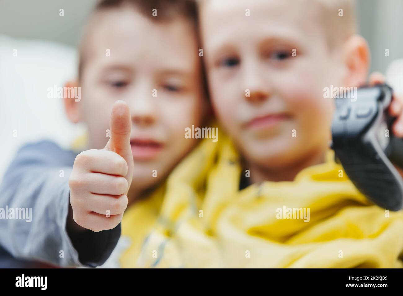 Young boy giving a thumbs up gesture of success Stock Photo - Alamy