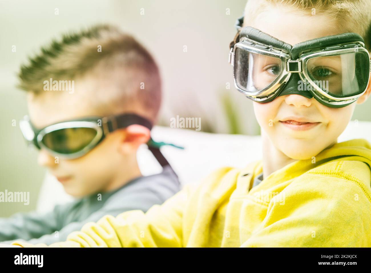 Cute high key portrait of a young boy wearing goggles Stock Photo