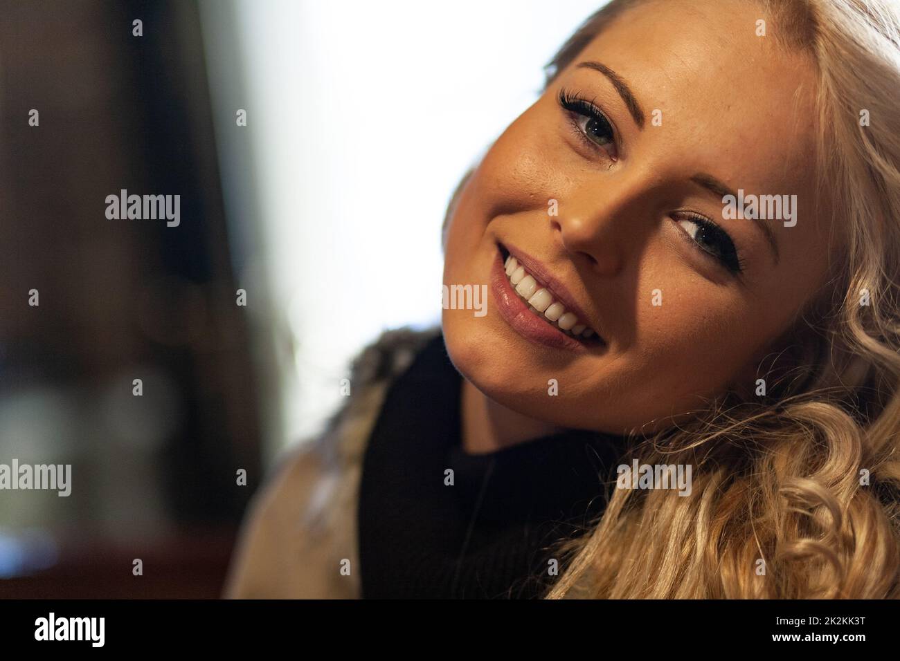 Pretty young blond woman with a sweet smile Stock Photo
