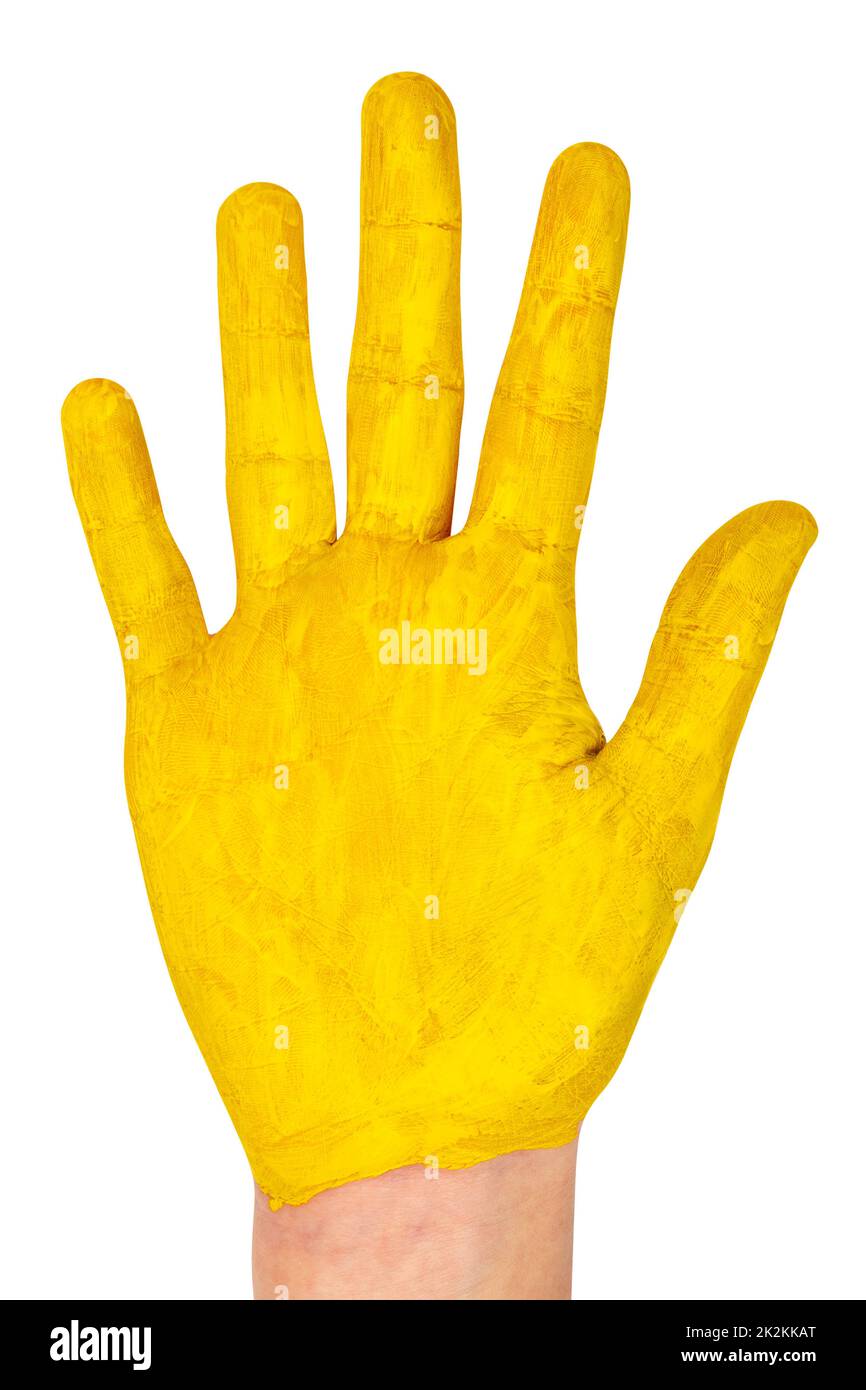 Child hand painted in yellow paint, creative concept Stock Photo