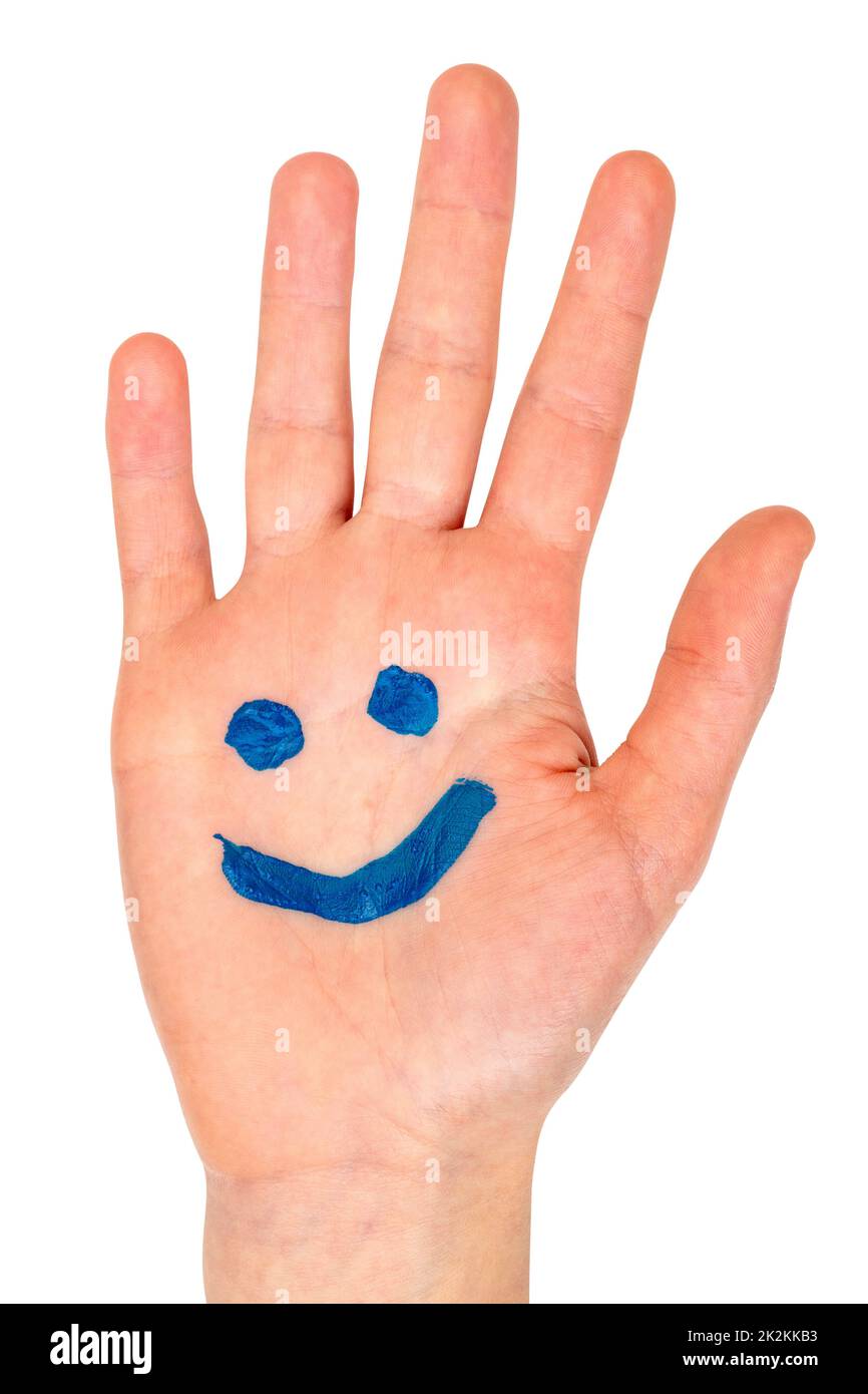 Blue smiling face drawn on child palm Stock Photo