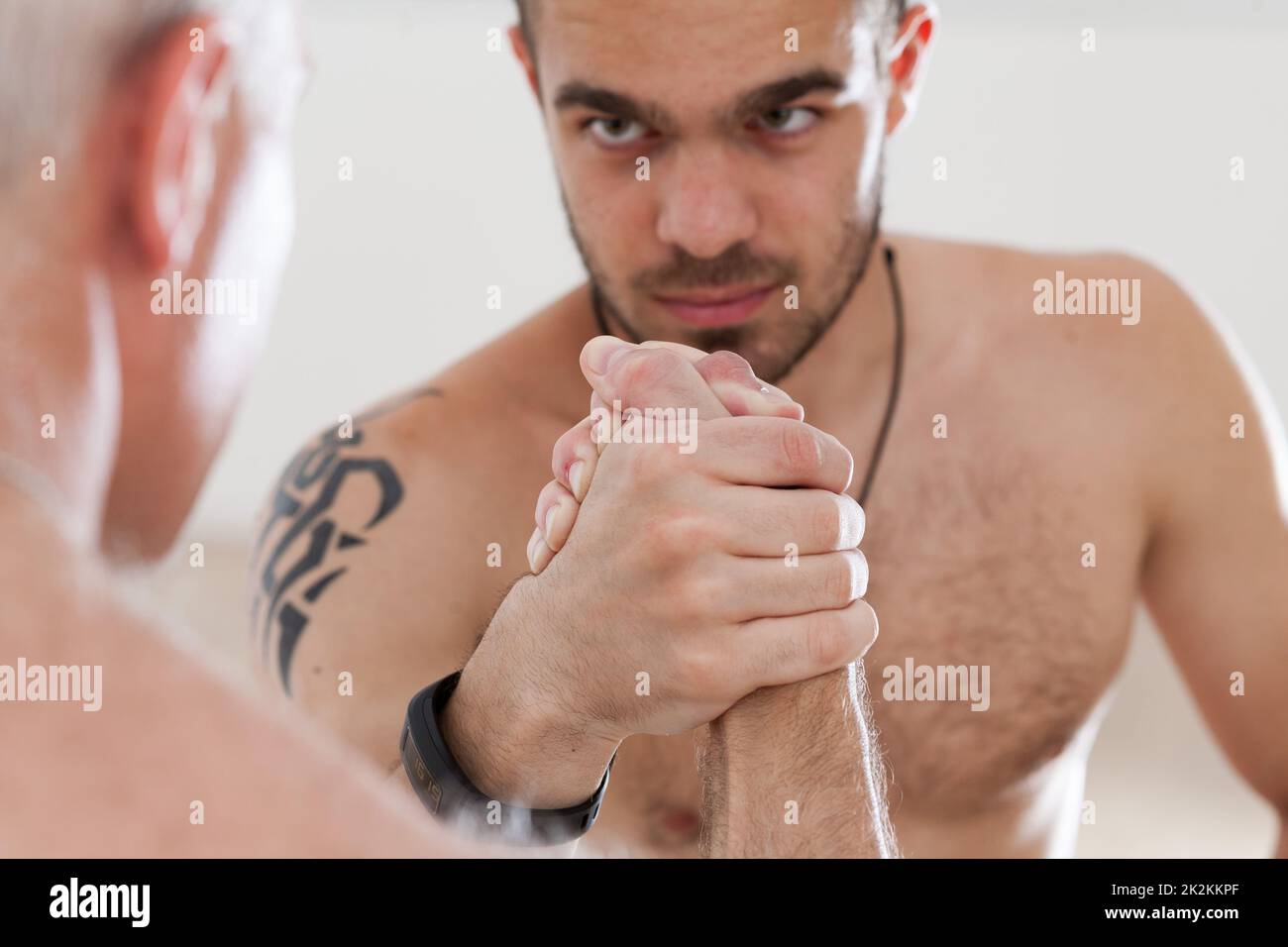 challenging look of a cadet challenging his master Stock Photo