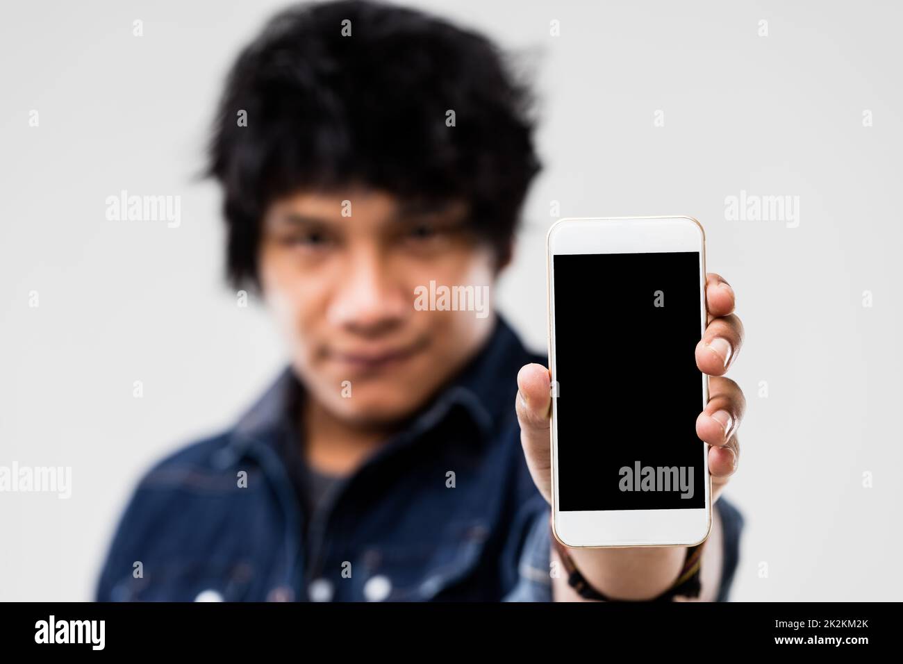 man showing smartphone screen to you Stock Photo
