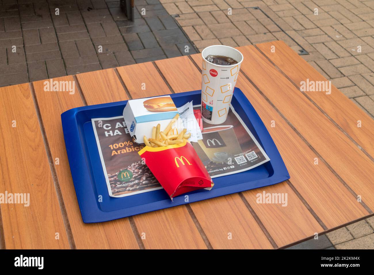 Sofia, Bulgaria - June 6, 2022: McDonald's Filet-O-Fish menu with McDonald's fish sandwich known as Filet-O-Fish, french fries and Coca-Cola. Stock Photo