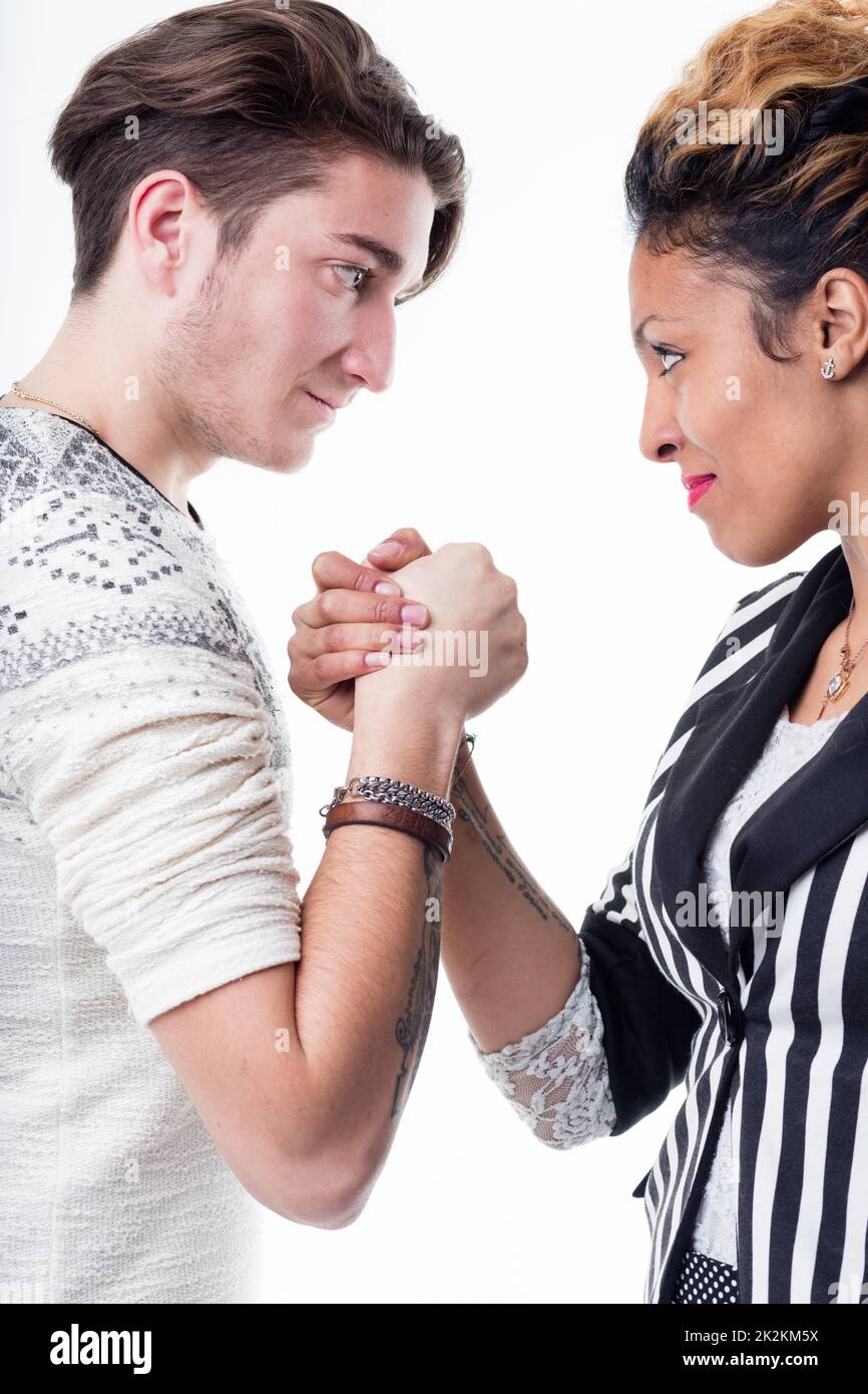 Man and woman facing off in a battle of wills Stock Photo