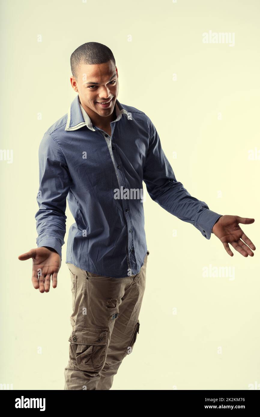 Charismatic young Black man gesturing with his hands Stock Photo