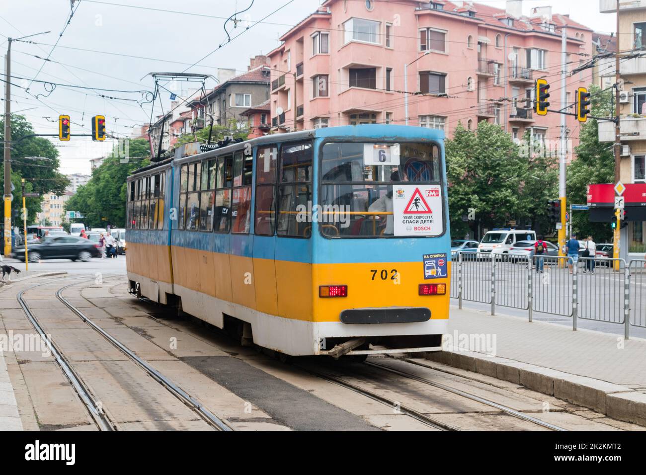 Sofia, Bulgaria - June 6, 2022: Blue and yellow tram on tram stop in Sofia. Stock Photo