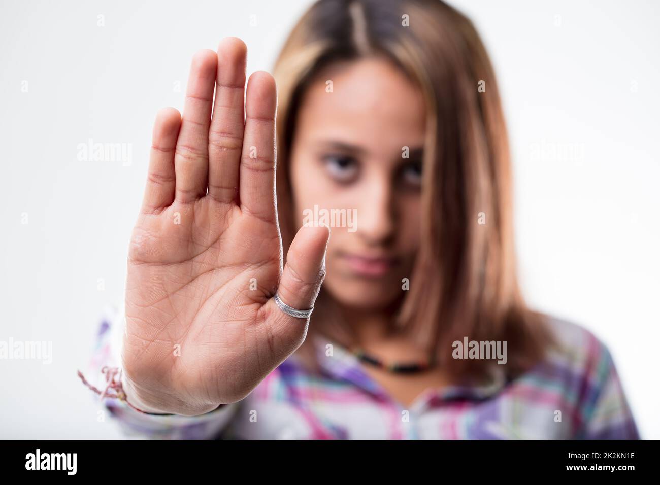 Stern woman making a halt gesture Stock Photo