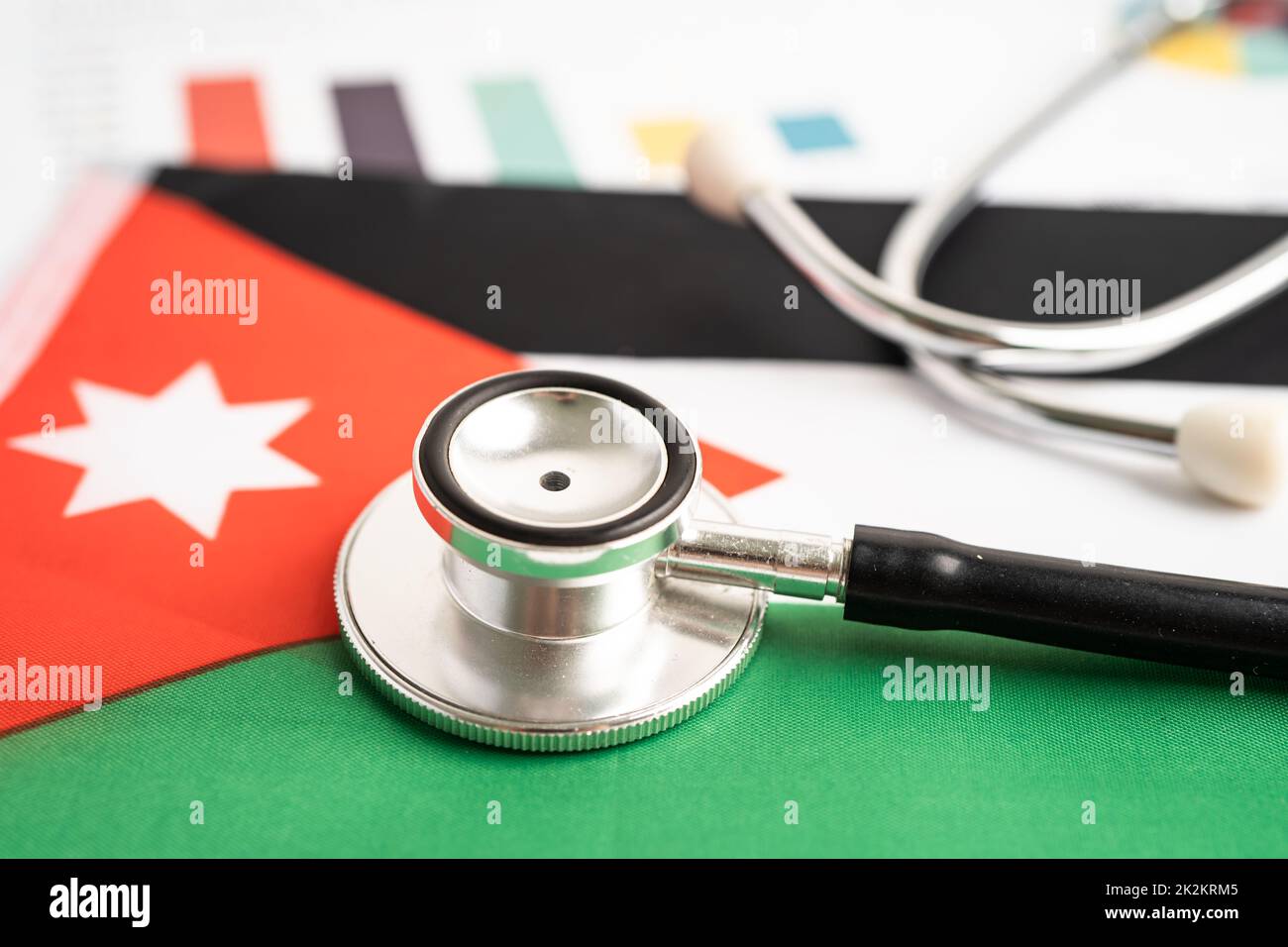 Black stethoscope on Jordan flag background with graph, Business and