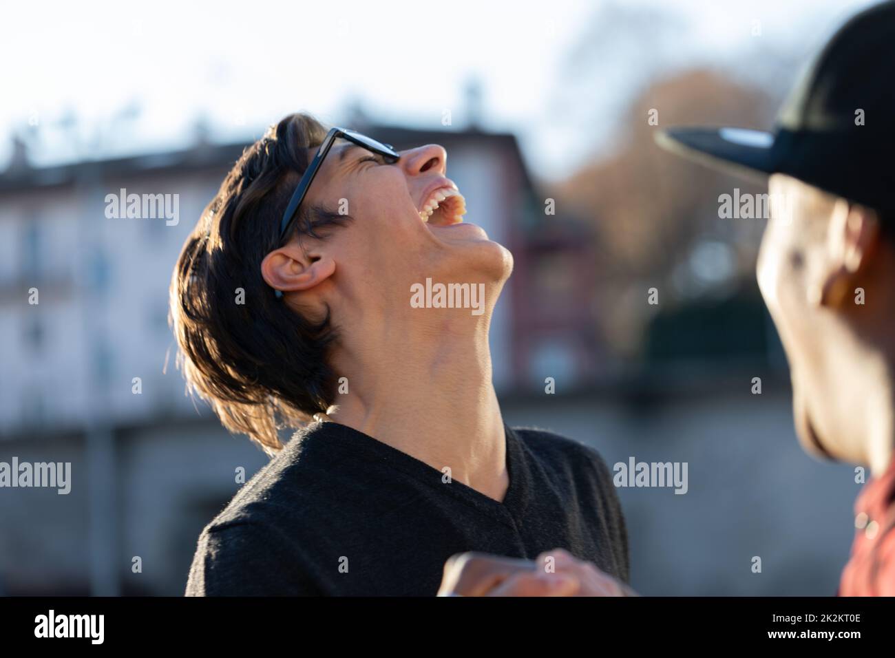 laughter of a friend with another Stock Photo