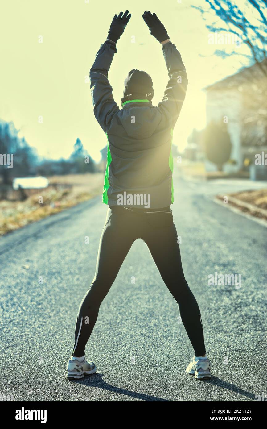first the warm-up and then the runner will train Stock Photo