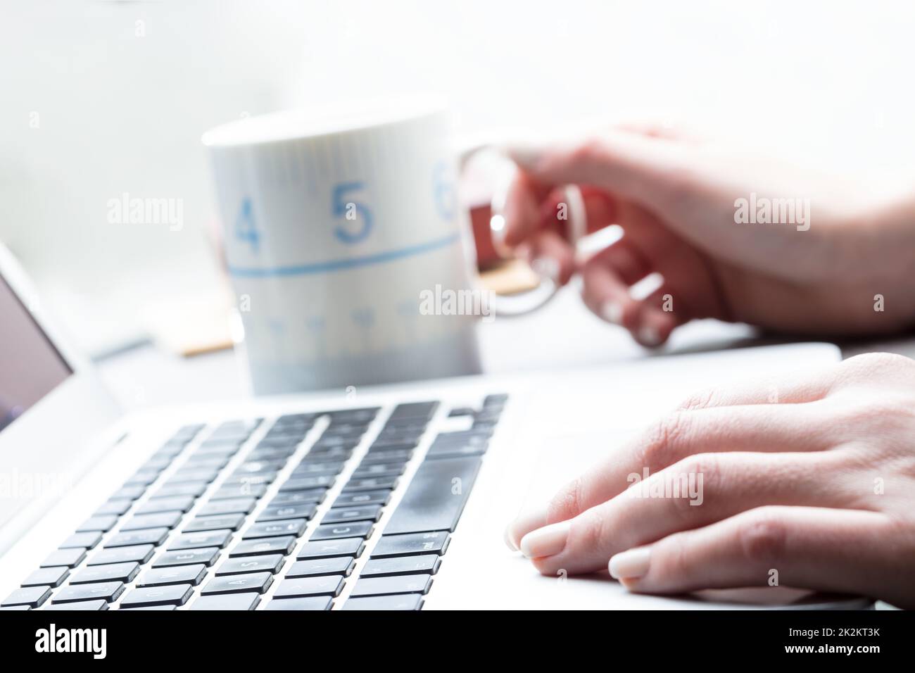 Businesswoman taking a coffee break at work Stock Photo - Alamy