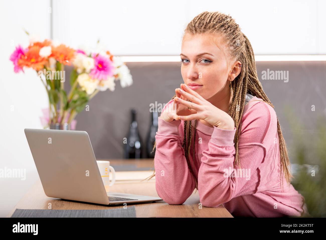 Thoughtful young woman looking sideways at camera Stock Photo