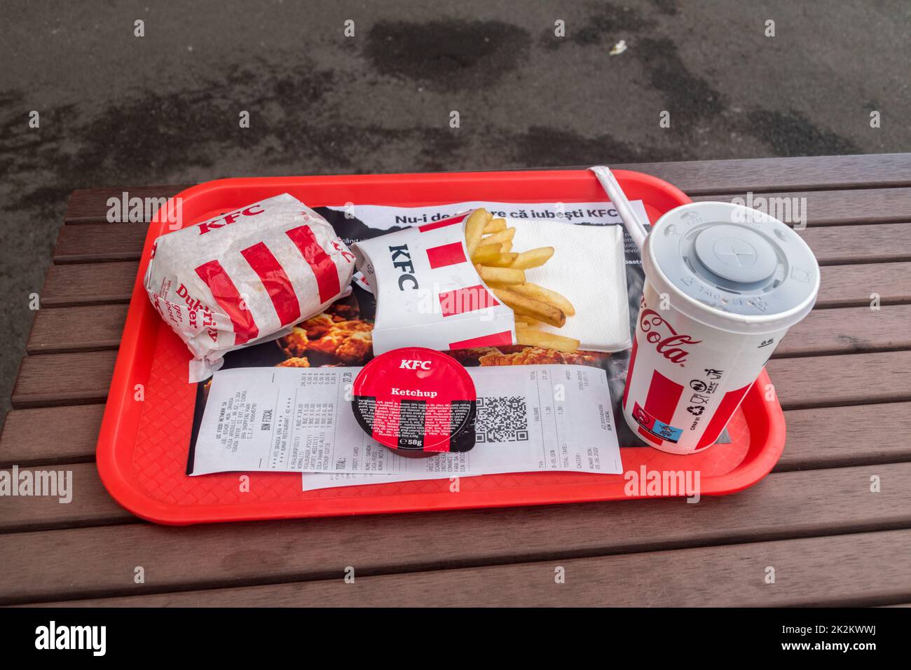 Oradea, Romania - June 9, 2022: KFC menu with Real Burger Picant, french fries, ketchup and Pepsi. Stock Photo