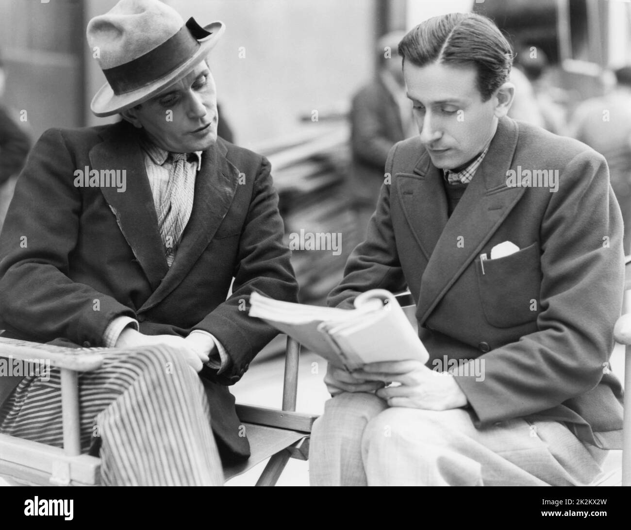 Raymond Bernard French director,on the set of 'Amants et voleurs' with actor Pierre Blanchar. France, 1935 Stock Photo