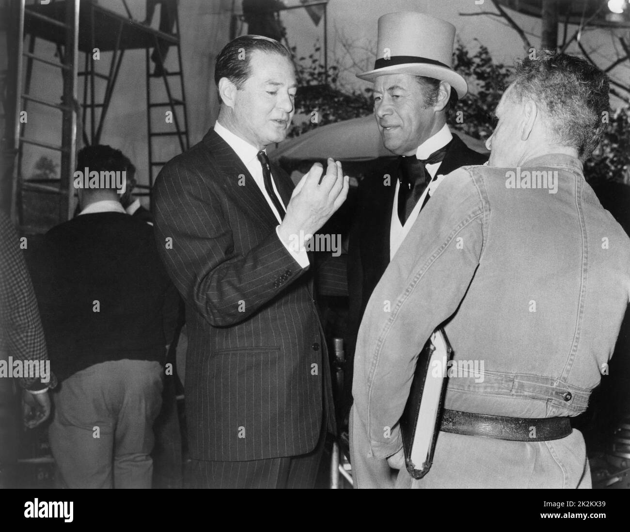 The Yellow Rolls-Royce USA, 1964 Director: Anthony Asquith The writer Terence Rattigan discusses the Ascot scene with the director and actor Rex Harrison. Stock Photo
