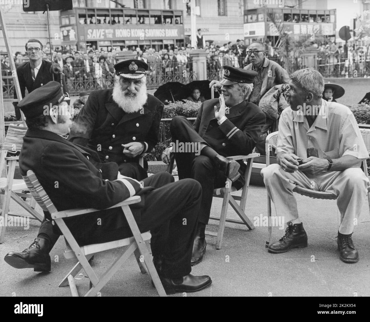 Richard Brooks with Jack Hawkins, Noel Purcell and Peter O'Toole on the set of Lord Jim USA, 1965 Based on the novel by Joseph Conrad Stock Photo